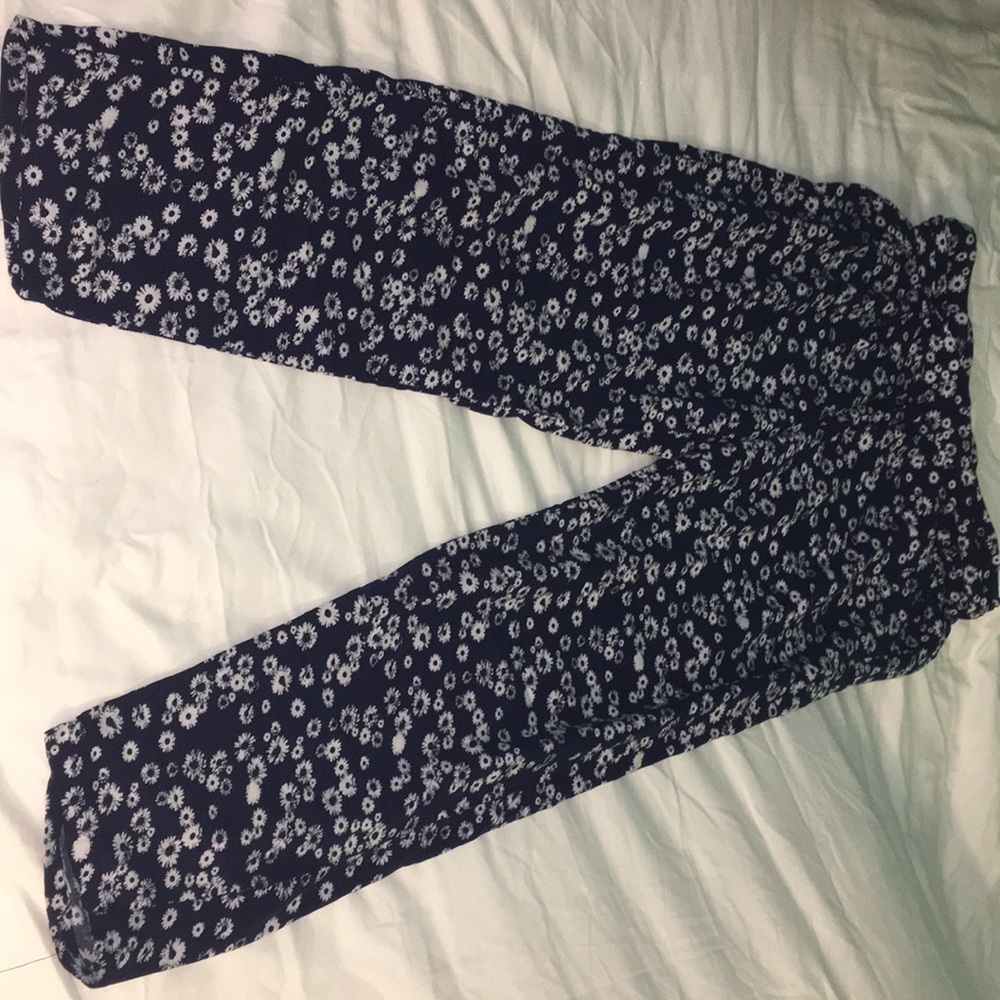 Justice dark blue pants with white flowers